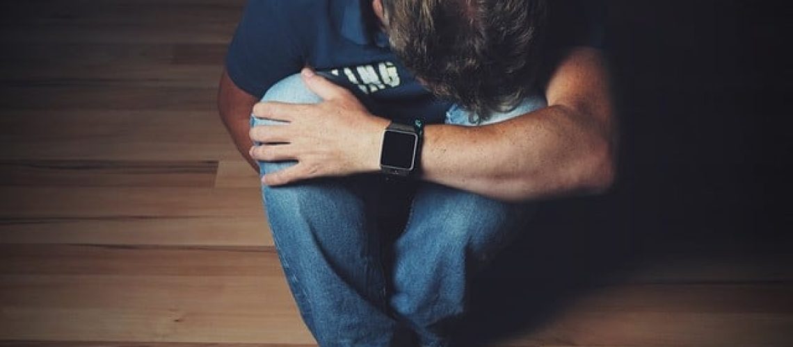 Man Depressed Sitting