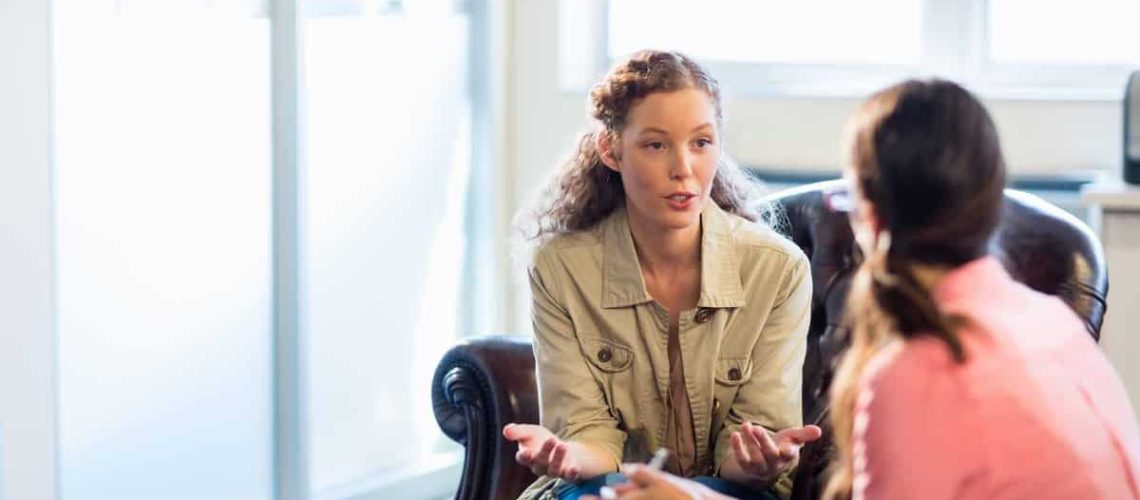 Psychologist having session with her patient in office and dealing with women's issues