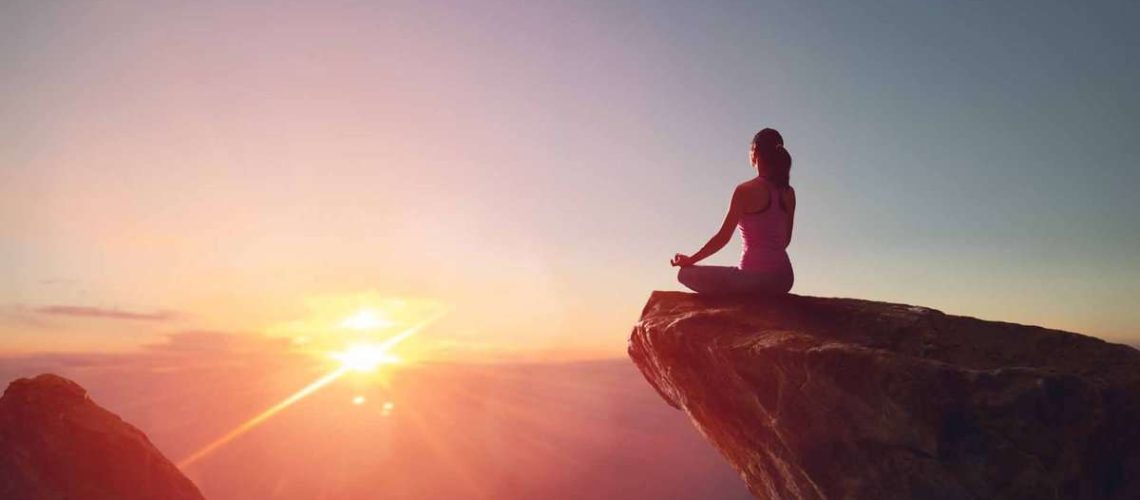 Woman practicing yoga and meditation for mindfulness-based therapy