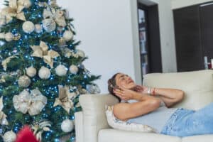 Latin woman is inside her house enjoying her moments alone in the living room of her house