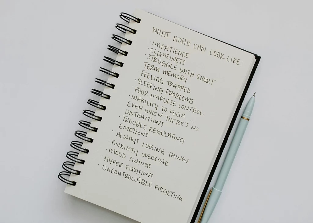 notebook with a list of adhd symptoms