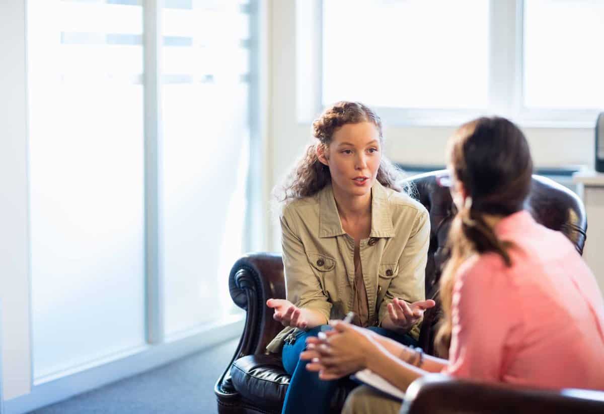 Psychologist having session with her patient in office and dealing with women's issues