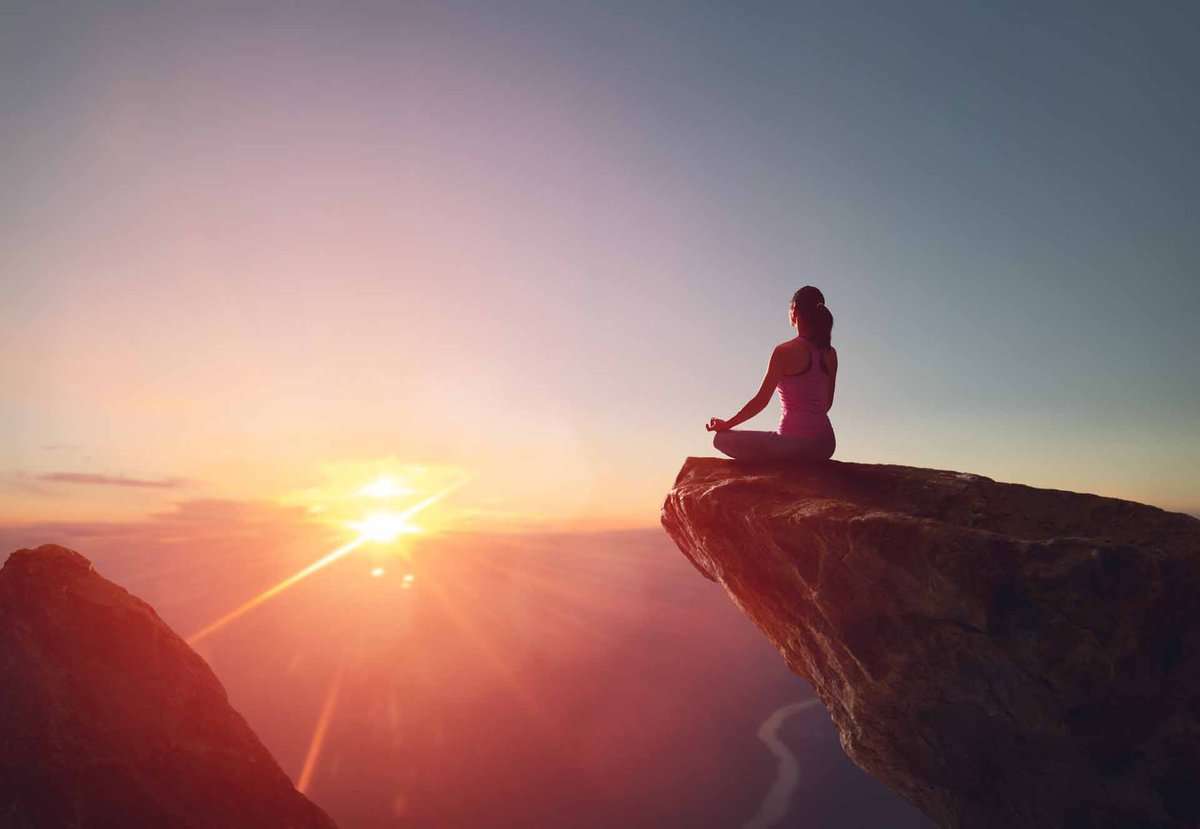 Woman practicing yoga and meditation for mindfulness-based therapy